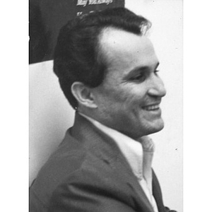 Head-and-shoulders profile of a man smiling and participating in a program at La Alianza Hispana, Boston.