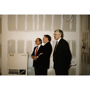 Boston mayor Raymond Flynn (center) stands with two other men at the Taino Tower ribbon cutting ceremony.