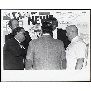 Five men stand together and converse at the South Boston Boys and Girls Club Alumni Party