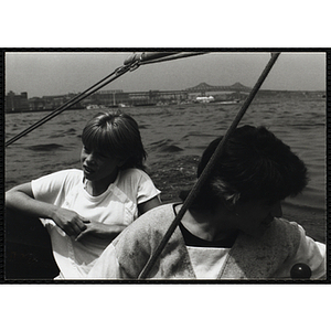 Two children sitting in a sailboat