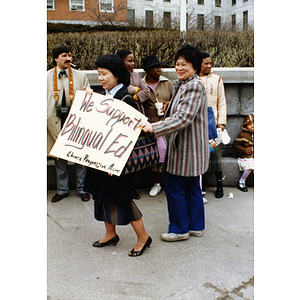 Two women from the Chinese Progressive Association at a rally held outside the Massachusetts State House