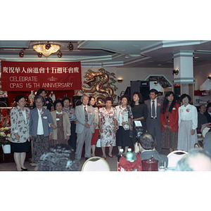 Guests stand at the Chinese Progressive Association's 15th Anniversary Celebration