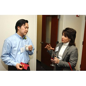 Victor Tong speaks with a woman at The National Council Dinner