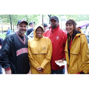 Senior Vice President of Enrollment Management and Student Affairs Philomena Mantella (far right) stands with NU supporters before the football game