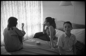 Unidentified children smoking in a hotel room, Newport Folk Festival