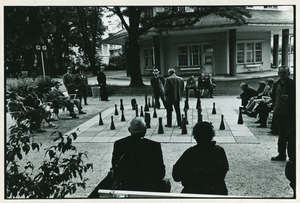 Men playing outdoor chess