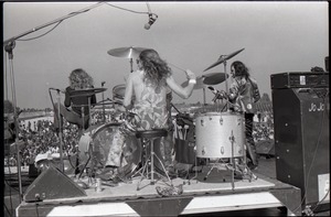 Hollywood Speedway Rock Festival: Jo Jo Gunne in performance, view from behind drummer (Curly Smith), with Jay Ferguson and bassist (Jimmy Randall)