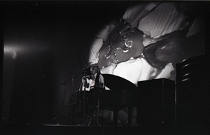 Unidentified female twelve-string guitar player in concert