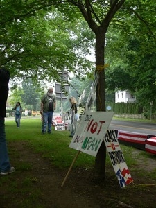 Vietnam veteran at an anti-Iraq War protest, looking at antiwar signs