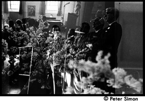 Double exposure of speakers on the dais at the Martin Luther King memorial service