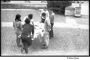 United States Student Press Association Congress: group outside gathered around table of papers