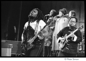 Peter Tosh: portrait wearing beret, dark glasses, and a Legalize it tee shirt, smoking a pipe