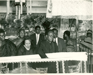 Shirley Graham Du Bois and Kwame Nkrumah beside open casket during state funeral for W. E. B. Du Bois