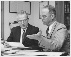 John W. Lederle and Lamar Soutter discussing a paper