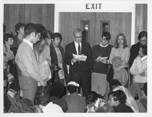 John W. Lederle reading a statement to a group of students