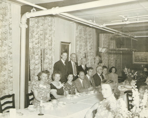 Faculty and class of 1945 members pose at a banquet