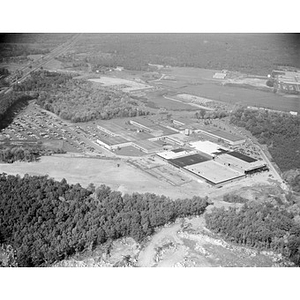 Suburban location of industrial buildings, some new construction, unidentified