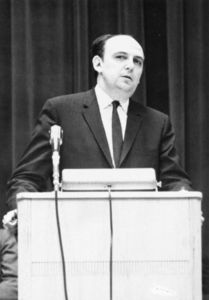 Vladimir Petrovsky speaking from podium at a Suffolk University event