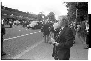 Joe Cahill Funeral, legendary republican in all IRA campaigns since the late 1930s. Photographs taken at his funeral, as it moved from the house in Andersonstown to Milltown cemetery on the Falls Road, Belfast. Also included are shots of the Andersonstown RUC station which has since been demolished. Mourners included all the top Sinn Fein officials and republican supporters  Gerry Adams, Martin McGuinness, Annie Cahill (his widow). An earlier portrait by Bobbie was used on the memorial card. Sheets 1-5