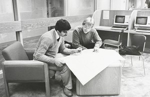 Students studying at Boston College, possibly in the O'Neill Library building