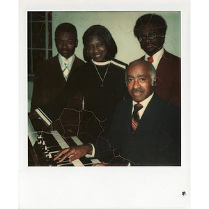The Hunter family poses in front of a Hammond organ