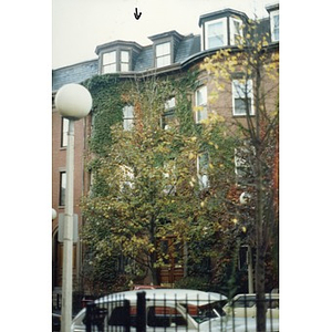 Ivy-covered brick row house at 98 West Concord Street in Boston.