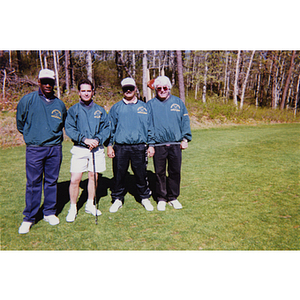 A four-man golf team wearing commemorative t-shirts at the Charlestown Boys and Girls Club Annual Golf Tournament