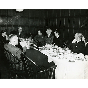Arthur T. Burger (head of table) sits with a group of diners at a Tom Pappas Chefs' Club dinner