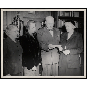 Executive Director of Boys' Club of Boston Arthur T. Burger (third from left) poses with three members of the Mothers' Club