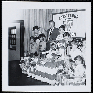 The Little Sister Contest winners posing with their brothers and three judges, including John W. Sears, at center