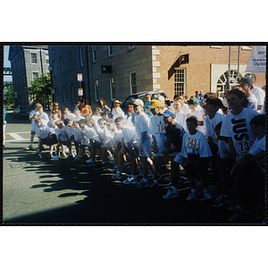 Children gather at a start line at the Battle of Bunker Hill Road Race