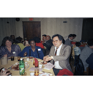 People eat at a restaurant table during the Chinese Progressive Association's celebration of the Lunar New Year