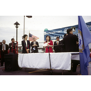 Speaker addresses assembled protestors at their victory ceremony