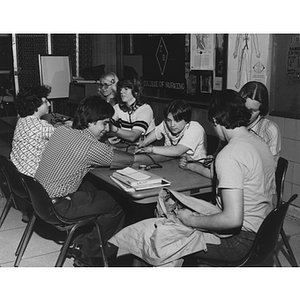 College of Nursing students practicing taking blood pressure in the Sigma Theta, College of Nursing Honor Society, study area