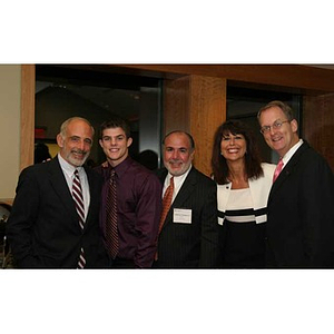 Five people pose together at the Torch Scholars dinner