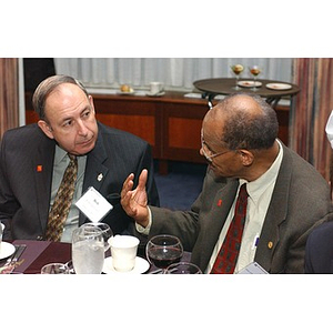 Two men speak together at The National Council Dinner