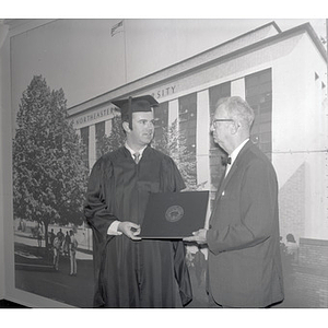 Alfred J. Smith congratulates his son Roy at Northeastern's June 14 commencement exercises