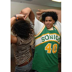 Melanie Arvajo and Danny Vazquez dance at the Torch Scholars talent show