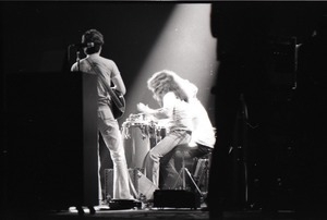 Santana concert at the Springfield Civic Center: Carlos Santana (back to camera) playing to the band