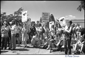 Protesters at a Mobilization for Survival antinuclear demonstration near Draper Laboratory, MIT, carrying signs opposing the MX missile and nuclear power