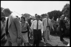 Kitty and Mike Dukakis walking hand-in-hand at the 25th Anniversary of the March on Washington