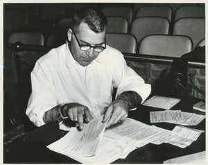 Doric Alviani at work with papers