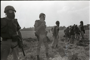 Antiwar demonstration at Fort Dix, N.J.: line of military police in gasmasks and riot gear