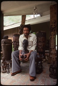 Bill Withers: Withers surrounded by African sculpture and cupping the breasts of a bust
