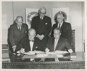 Presidents Bruce Barton of ICD and Carroll V. Newsom of NYU signing an affiliation agreement