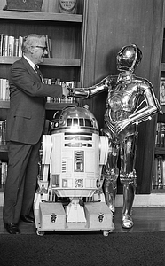 Unidentified man with R2-D2 and C-3P0 from Star Wars films at Boston City Hall