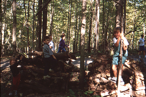 Hopkins Forest Fall Festival, 1999. 13. Kids play on wood pile in sugarbush.