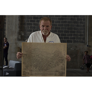 Frank Biagiotti holding East Boston map
