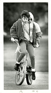 Martha Galvao rights her bike with her dad, Joe