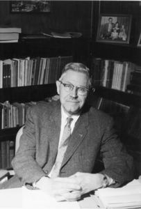 Suffolk University Vice President Donald W. Goodrich (1966-1969), seated at desk